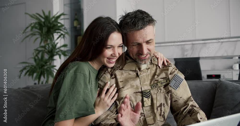 A military couple communicates online with friends and relatives. Online communication
