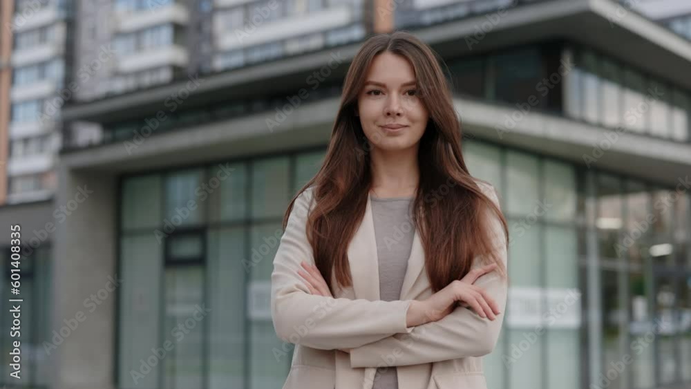 Cute Caucasian Young Woman Standing, Crossing Hands, Looking to Camera Outside on Street. Feeling Good, Businesswoman Portrait. Business Attractive Modern Manager, Beautiful Cute Caucasian Young Woman Standing, Crossing Hands, Looking to Camera Outside on Street. Feeling Good, Businesswoman Portrait. Business Attractive Modern Manager, Beautiful