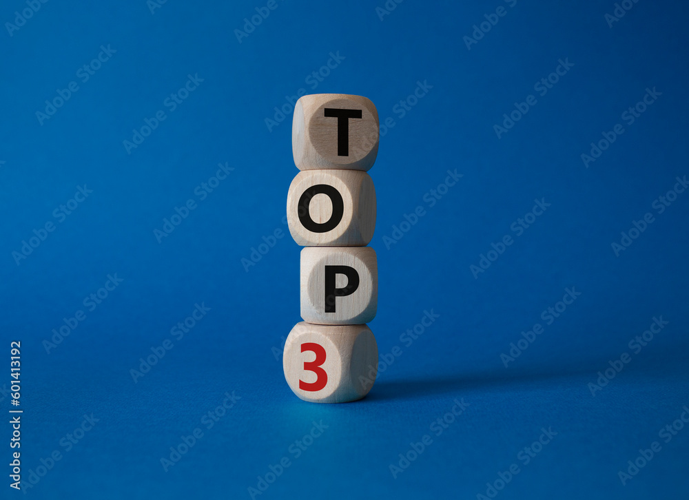 Top 3 symbol. Concept word Top 3 on wooden cubes. Beautiful blue background. Business and Top 3 concept. Copy space. Top 3 symbol. Concept word Top 3 on wooden cubes. Beautiful blue background. Business and Top 3 concept. Copy space.
