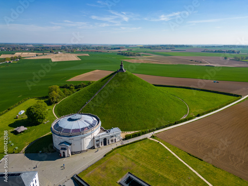 Aerial view farm field, Lion's Mound, Battle field, Napoleon, Waterloo, Belgium, green and sky, season. Aerial View at the Waterloo Hill with the statue of the lion of Memorial Battle of Waterloo