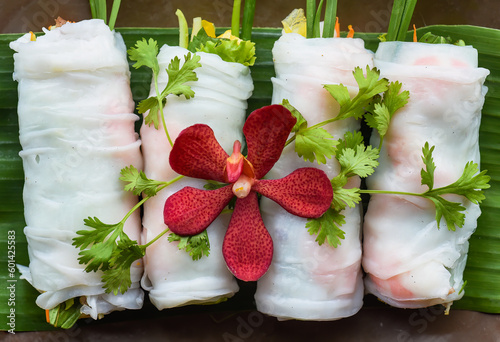 Vietnamese Pho spring roll with seafood, tofu, vegetables isolated on black background for a menu