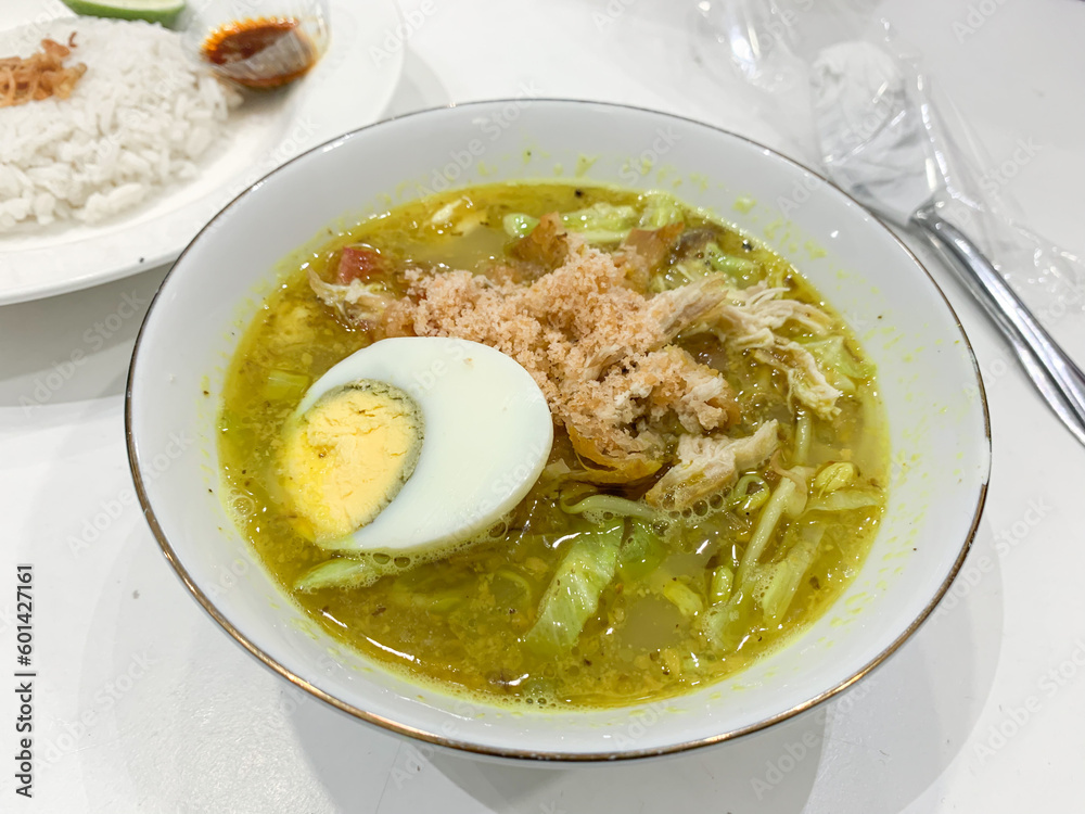 Soto Ayam Indonesian food served in a white bowl.