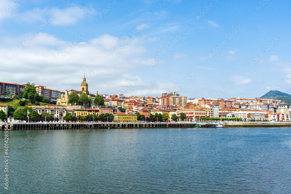 View of Portugalete town by Nervion river, and Sandra Maria basilica, Basque Country, Spain. View of Portugalete town by Nervion river, and Sandra Maria basilica, Basque Country, Spain.