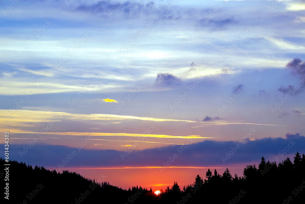 Obraz premium the expressive contrast of the clouds in the sky and sun. The nature and beauty of clouds