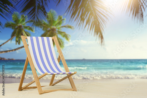 Fototapeta Naklejka Na Ścianę i Meble -  The concept of relaxing on the beach. Beach lounger on a sandy beach among palm trees. 3D render