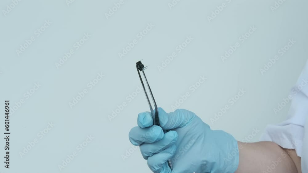 female scientist, doctor holding microprocessor, microchip, biochip with tweezers for immunocytochemical studies organs, concept virus genotyping, experimental developments in nanotechnology medicine female scientist, doctor holding microprocessor, microchip, biochip with tweezers for immunocytochemical studies organs, concept virus genotyping, experimental developments in nanotechnology medicine