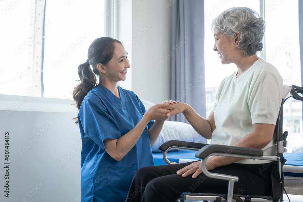 Asian senior care nurses and grandmothers provide caring support to elderly women hand clasp to encourage exercising with elder disabled person patient with caregiver in nursing care. Asian senior care nurses and grandmothers provide caring support to elderly women hand clasp to encourage exercising with elder disabled person patient with caregiver in nursing care.