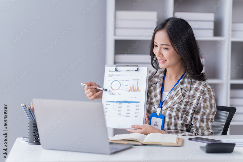 Young happy businesswoman working with tablet and mobile phone in corporate office. Young happy businesswoman working with tablet and mobile phone in corporate office.