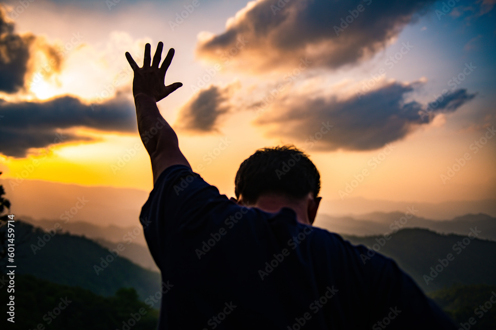 The human hand raises his palm open to worship. Eucharist, bless the Lord, help Catholics repent of Easter. behind the concept of Christianity Battle and Victory for God - obrazy, fototapety, plakaty 