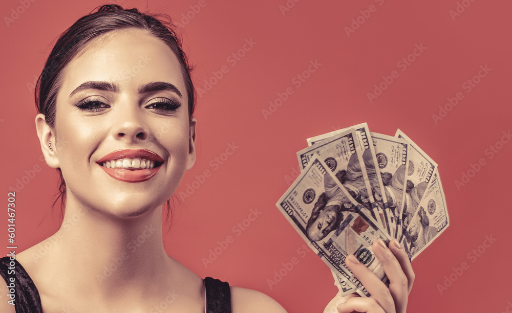 Luxury, beauty and money concept. Woman with dollars in hand. Girl holding cash money in dollar banknotes. Woman holding lots of money in dollar currency