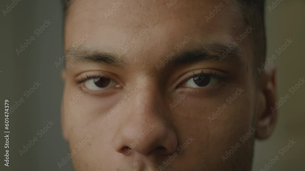 Black Man Eyes Opening Close Up. African American face smiling looking at camera. Black Man Eyes Opening Close Up. African American face smiling looking at camera.