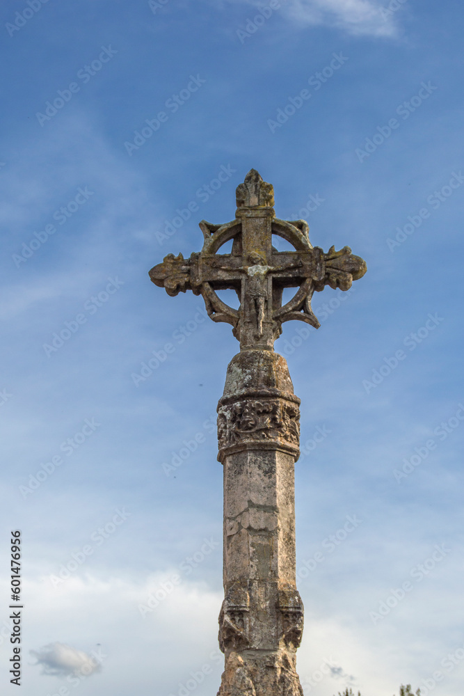 stone cross on background sky in Covarrubias, province of Burgos. Spain