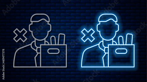 Glowing neon line Dismissed sad young man carrying box with his personal belonging leaving his job icon isolated on brick wall background. Employee fired from work. Vector