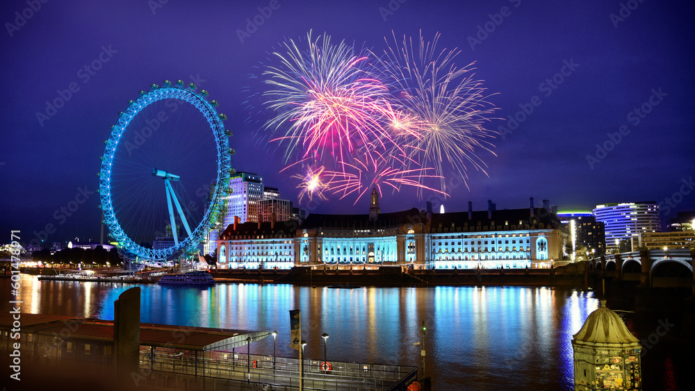 Obraz premium Fireworks sparkling in London sky next to river Thames and famous Ferris wheel. Festivity in the United Kingdom