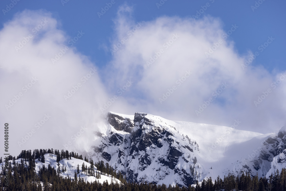Sky Pilot Mountain covered in Snow. Canadian Landscape Nature Background. Squamish, British Columbia, Canada. Sunny Day Sky Pilot Mountain covered in Snow. Canadian Landscape Nature Background. Squamish, British Columbia, Canada. Sunny Day