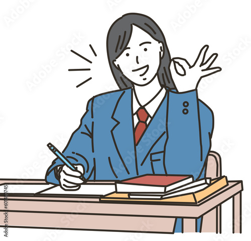 笑顔でOKポーズをする勉強中の女子学生