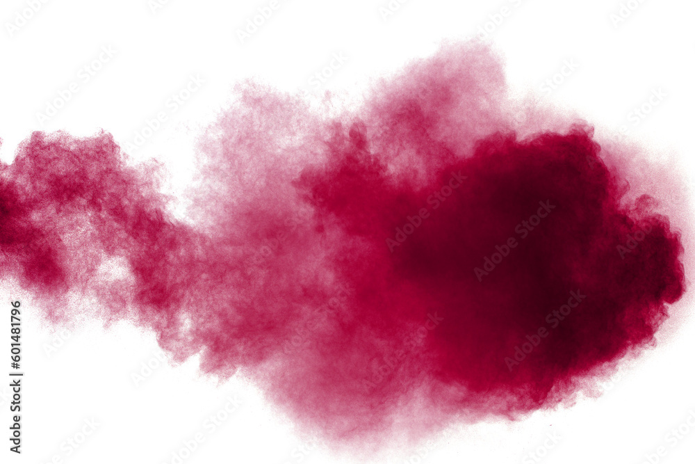Abstract red dust splattered on white background. Red powder explosion.Freeze motion of red particles splashing. Abstract red dust splattered on white background. Red powder explosion.Freeze motion of red particles splashing.