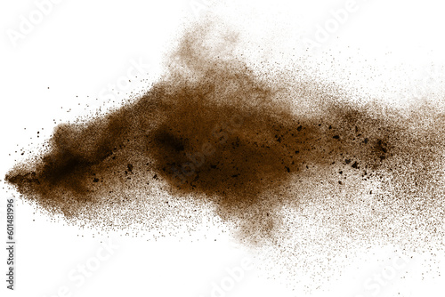 Deep Brown particles splattered on white background. Brown dust splash.
