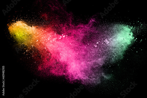 Multi color powder explosion on black background.