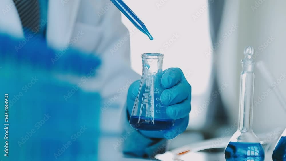 Medical Research Laboratory: Portrait of a Beautiful Female Scientist in Goggles Using Micro Pipette for Test Analysis. Advanced Scientific Lab for Medicine, Biotechnology, Microbiology Development