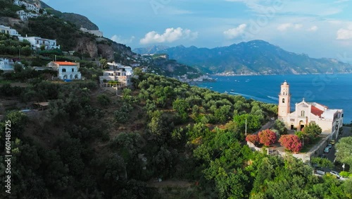 Beautiful aerial drone view of Conca dei Marini and Tovere San Pietro Villages. Top view of Amalfi Coast houses surrounded by green nature and blu Mediterranean sea. photo