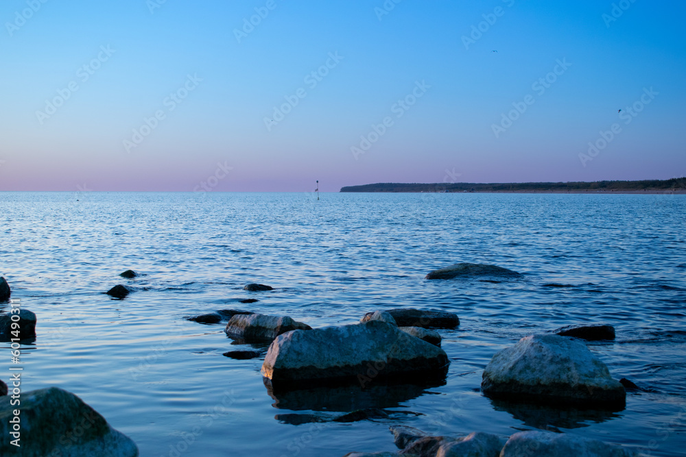Sunset enveloping the blue sea and the beach Sunset enveloping the blue sea and the beach