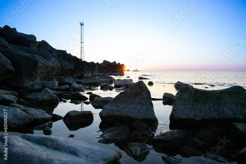 Sunset enveloping the sea and the beach photo