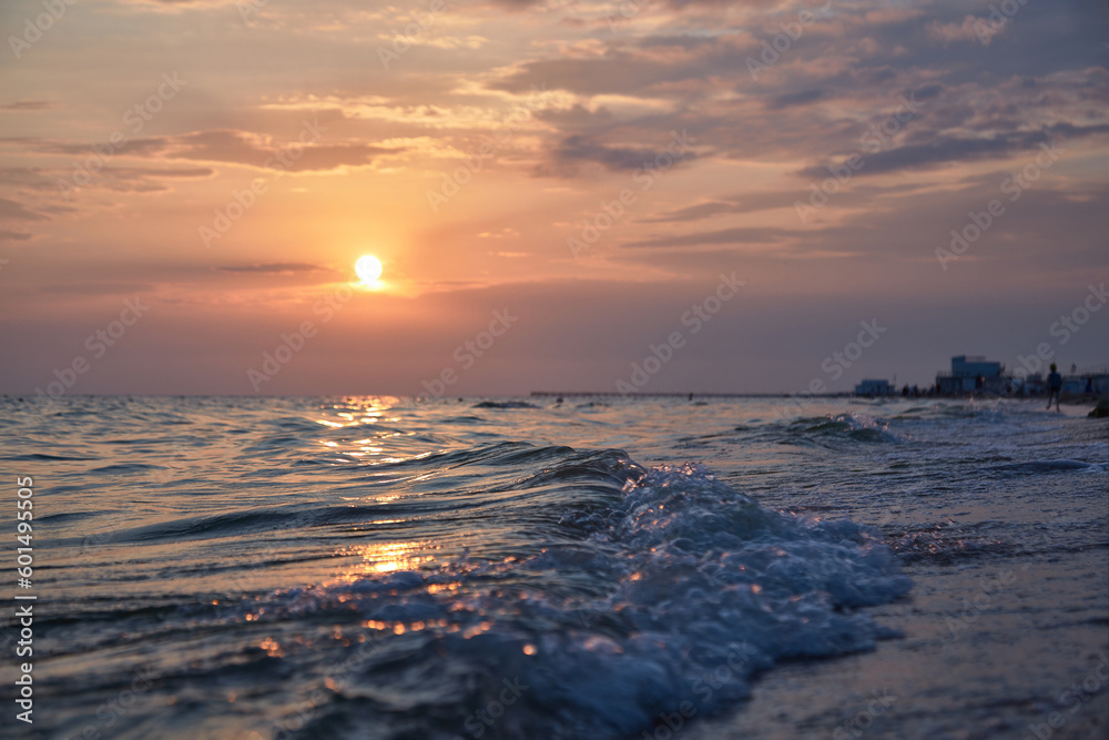 Obraz premium Orange-gold sunset, sky, sunlight, summer mood landscape with sea sunset on beach.