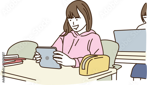 笑顔でタブレットを操作する女の子
