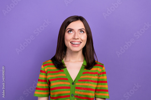 Photo of gorgeous pretty lady wear bright clothes looking empty space special offer isolated on purple color background
