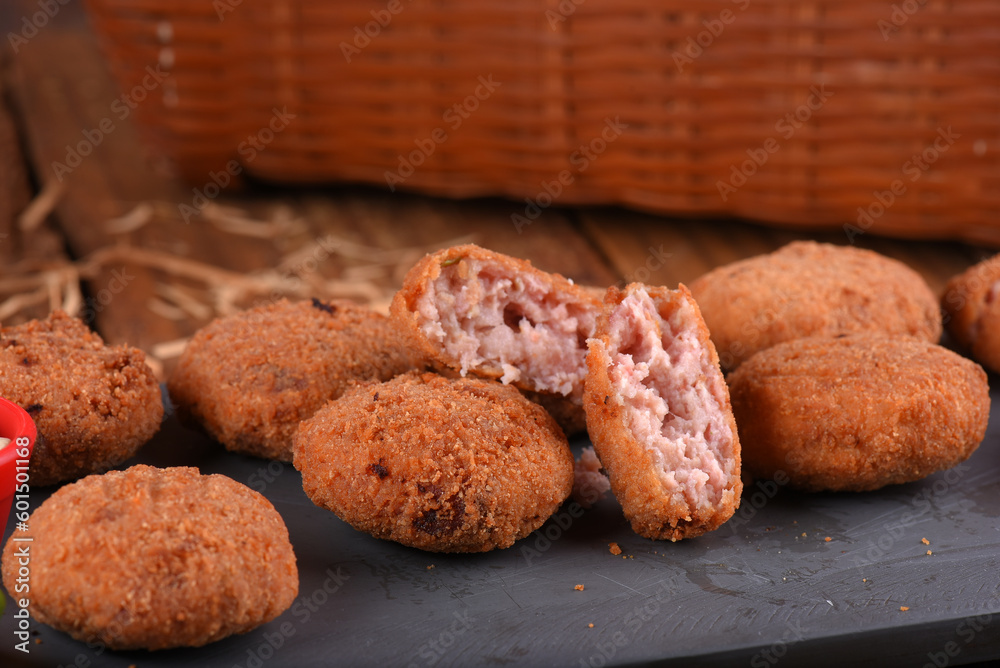 Fried and breaded codfish cake, fish empanadas, codfish cake, Brazilian-style codfish cakes, meat disc