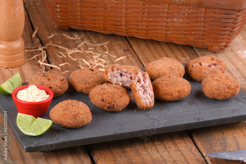 Fried and breaded codfish cake, fish empanadas, codfish cake, Brazilian-style codfish cakes, meat disc photo