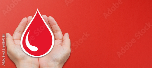 Blood donation concept on red background photo