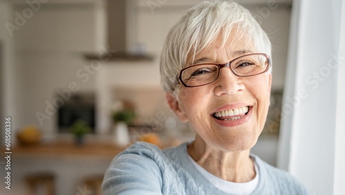 Close up portrait of one senior woman with short hair happy smile