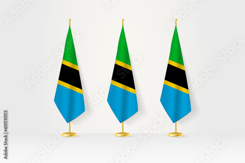 Three Tanzania flags in a row on a golden stand, illustration of press conference and other meetings.