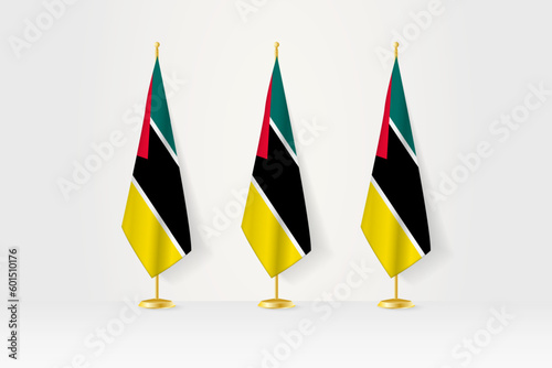 Three Mozambique flags in a row on a golden stand, illustration of press conference and other meetings.