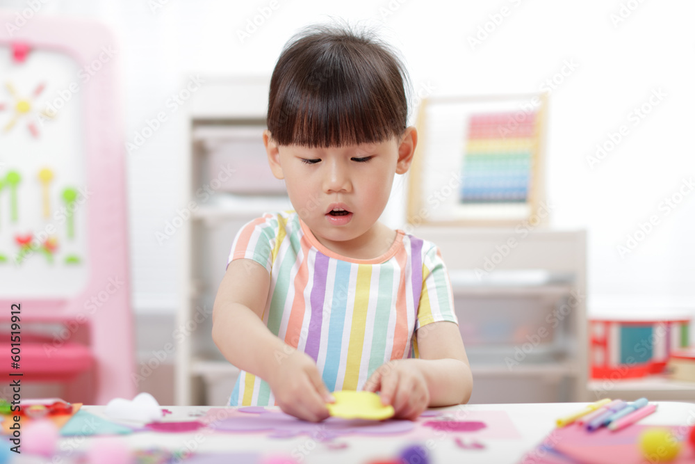 young girl making paper craft for homeschooling young girl making paper craft for homeschooling