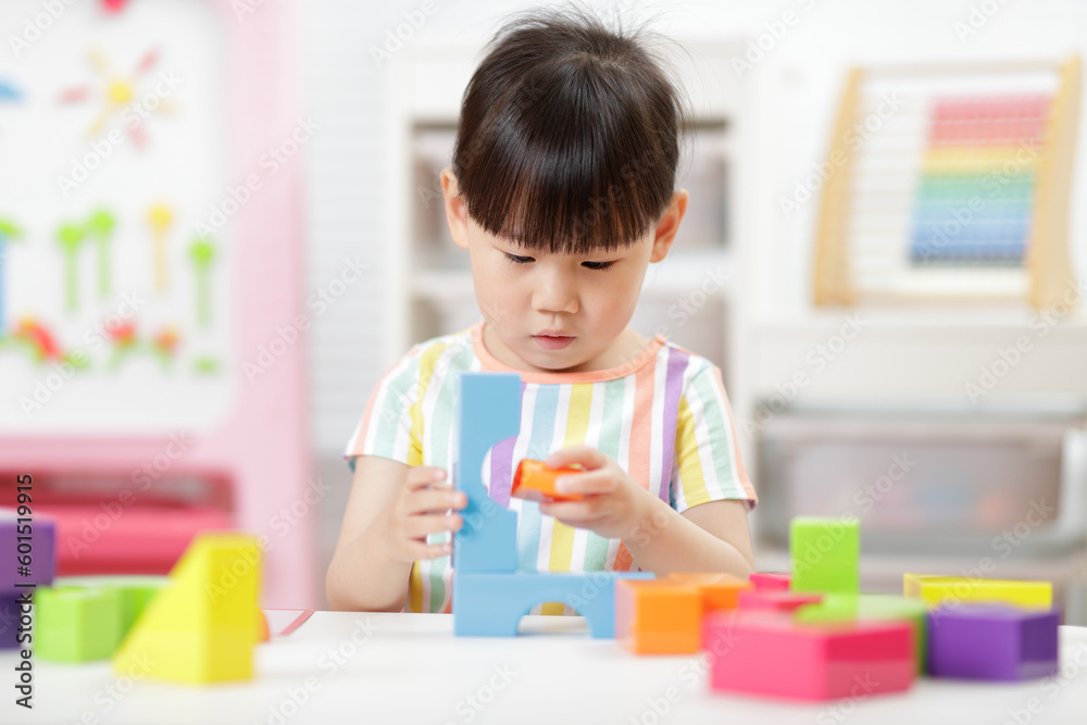 young girl playing creative blocks at home young girl playing creative blocks at home