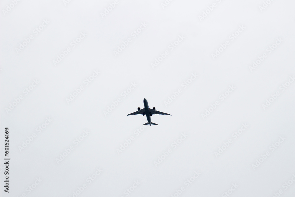 Passenger plane taking off in the dark cloudy sky Passenger plane taking off in the dark cloudy sky