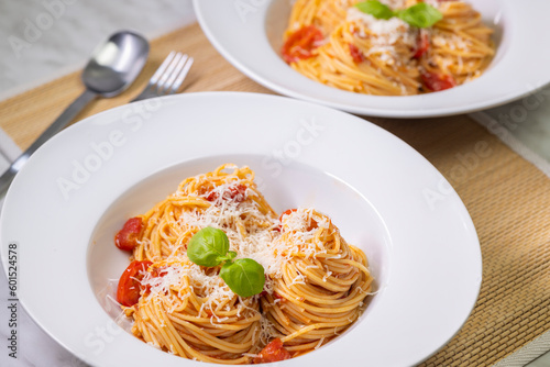 spaghetti with tomatoes, basil and parmesan cheese