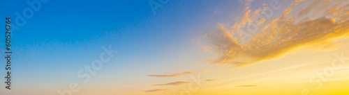 clouds and orange sky Real amazing panoramic sunrise or sunset sky with gentle colorful clouds. Long panorama  crop it