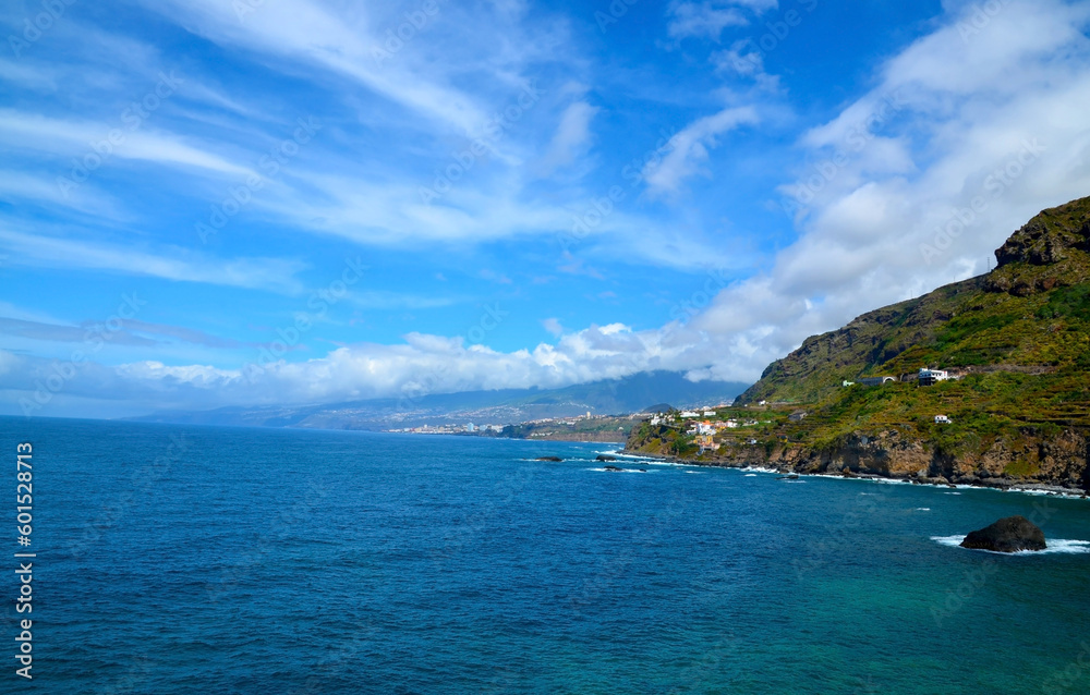 Beautiful view of Las Aguas, San Juan de la Rambla coastline with transparent turquoise blue ocean. Travel or summer vacation concept.