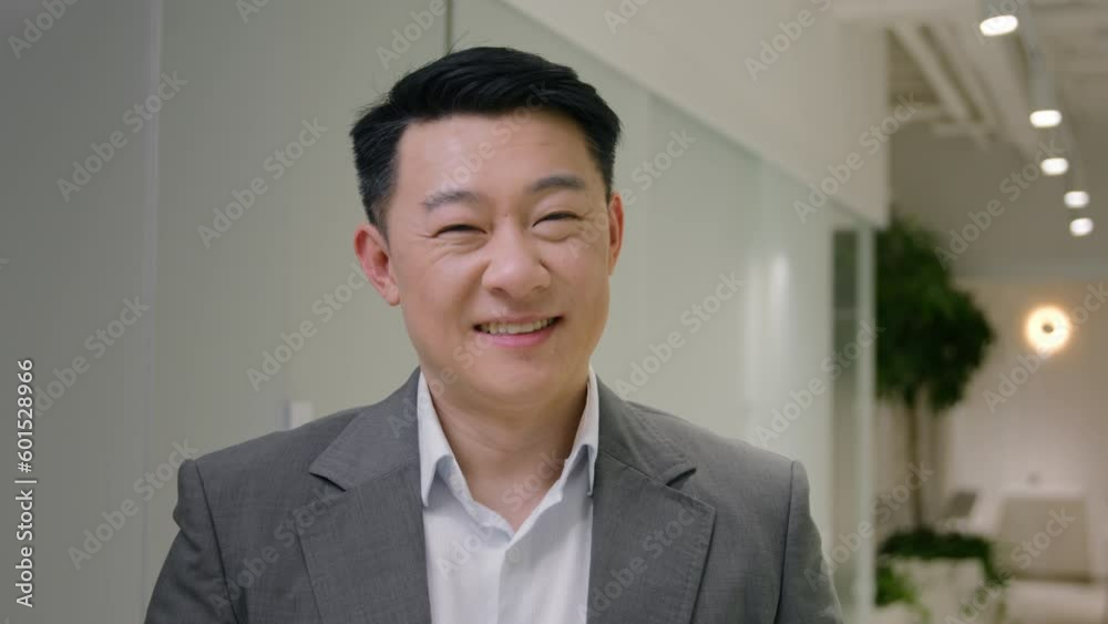 Portrait Asian happy man ethnic chinese japanese businessman male korean middle-aged smiling executive employer business owner leader in corporate office hallway looking at camera dental toothy smile Portrait Asian happy man ethnic chinese japanese businessman male korean middle-aged smiling executive employer business owner leader in corporate office hallway looking at camera dental toothy smile