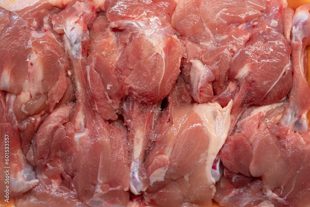Large Pile of Raw fresh Chicken Drumstick or chicken legs top view shot - Wholesale meat product in market