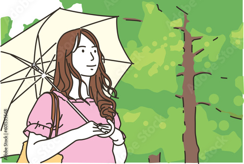日傘を差す若い女性