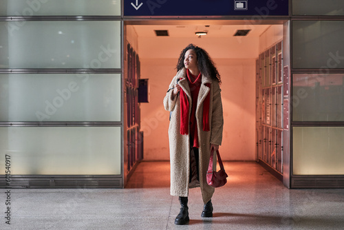 Wallpaper Mural Full length view of the multiracial woman holding bag and looking at the distance Torontodigital.ca