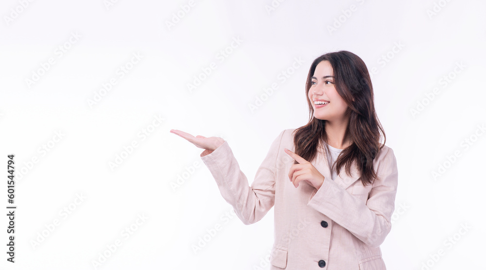 Excited asian businesswomen use finger pointing empty copy space on hand smiling face standing on isolated white background.Cheerful young girl wear suit finger pointing present or show something hand Excited asian businesswomen use finger pointing empty copy space on hand smiling face standing on isolated white background.Cheerful young girl wear suit finger pointing present or show something hand