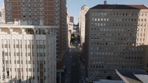 Narrow street between multistorey buildings. Forwards fly along building facades. San Francisco, California, USA