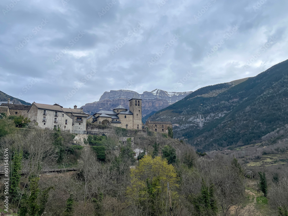 small village of Torla, gateway to the Ordesa y Monte Perdido National Park in the Spanish Pyrenees, Aragon, Spain, San Salvador Church, horizontal