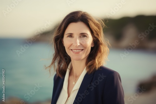 Portrait of a smiling businesswoman on the background of the sea